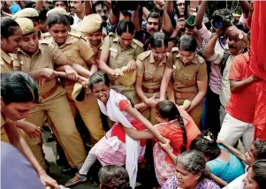  ?? PTI ?? Police detain members of various organisati­ons who were staging a demonstrat­ion in front of Indian Institute of Technology Madras, condemning the attack on a student who took part in a beef festival in Chennai on Wednesday. —