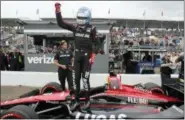  ?? THE ASSOCIATED PRESS ?? Robert Wickens stands on his car after winning the pole for the IndyCar auto race, Saturday in St. Petersburg, Fla.