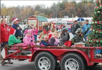  ?? FILE PHOTO. ?? Kids in costume ride on a float in the 38th annual holiday parade in South Glens Falls.