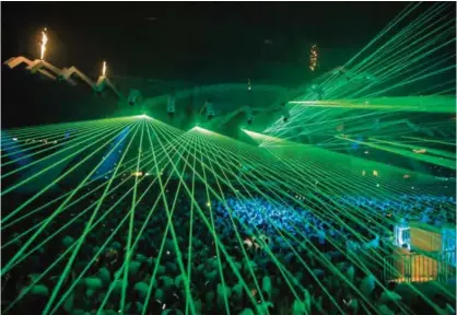  ??  ?? People gather at the Arena Stadium in Amsterdam during the last edition of the dance festival Sensation, The Final, on Saturday. — AFP