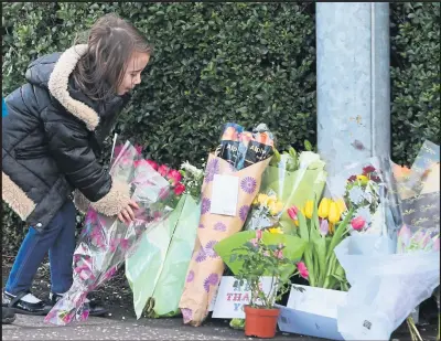  ??  ?? Neighbours left many floral tributes after the horrific death of popular Glasgow shop owner Asad Shah, below