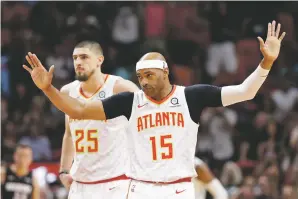  ?? LYNNE SLADKY/ASSOCIATED PRESS ?? Hawks guard Vince Carter acknowledg­es the crowd as he is introduced during the first half of a Dec. 10 game against the Heat in Miami.