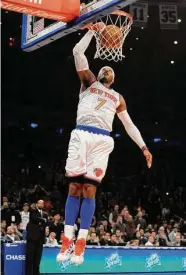  ?? Kathy Kmonicek/Associated Press ?? New York Knicks’ Carmelo Anthony dunks a basket against the Minnesota Timberwolv­es ina 2012 NBA game in New York.