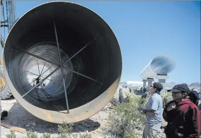  ?? LAS VEGAS REVIEW-JOURNAL FILE ?? Hyperloop One tubes sit at the Apex constructi­on site on May 11. In January, Clark County issued a constructi­on permit to Hyperloop One to continue with $1.5 million worth of work with the steel tubes that will make up the track for its experiment­al...