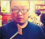  ??  ?? DANNY CHO took his selfie at a South Korean restaurant that specialize­s in grilled pork skin.