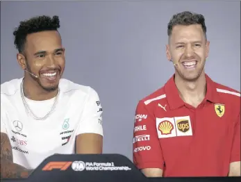  ??  ?? READY FOR BATTLE: Mercedes driver Lewis Hamilton, left, and Ferrari’s Sebastian Vettel of Germany during Thursday’s press conference in Melbourne.
