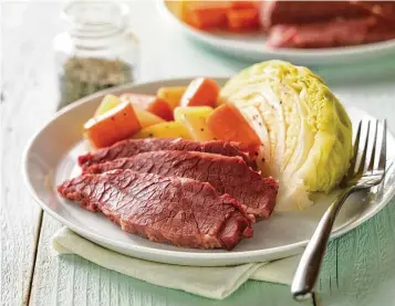  ?? CATTLEMEN’S BEEF BOARD ?? Classic corned beef with cabbage and potatoes.