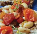  ?? (Arkansas Democrat-Gazette/Kelly Brant) ?? Roasted Tomatoes With White Beans served with seedy, multi-grain toast.