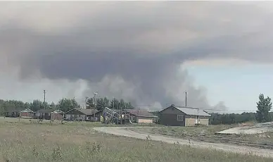  ?? DENNIS BITTERN ?? Smoke fills the skies near Manitoba’s Poplar River First Nation this week.