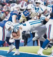  ?? ADRIAN KRAUS/AP ?? RB Jonathan Taylor set a franchise record with five TDs in the Colts’ 41-15 victory over the Bills on Sunday.