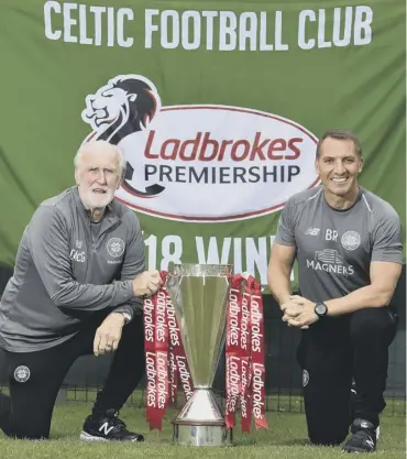  ??  ?? 0 Celtic boss Brendan Rodgers and club legend Danny Mcgrain, left, who will unfurl last season’s championsh­ip flag at Parkhead ahead of the first league game of the season against Livingston.