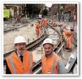  ?? TFGM. ?? Andrew Fender (left), chairman of Transport for Greater Manchester committee, and Mark Pritchard (MPT’s constructi­on manager for St Peter’s Square), with the final stretches of track now laid in St Peter’s Square and on Princess Street.