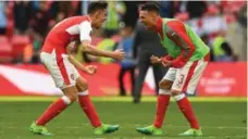  ?? JUSTIN TALLIS/AFP/GETTY IMAGES ?? Arsenal defenders Gabriel, left, and Kieran Gibbs celebrate reaching the FA Cup final after Sunday’s 2-1 extra-time semifinal defeat of Manchester City.