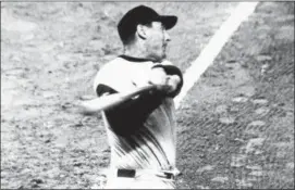  ?? THE ASSOCIATED PRESS ?? Boston Red Sox’s Ted Williams shown completein­g the actual third inning swing that brought him the 500th home run of his major league career.