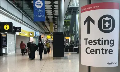  ??  ?? Passengers arrive at Heathrow airport on Friday. Travel corridors will be axed in effect from Monday morning. Photograph: Matthew Childs/Reuters