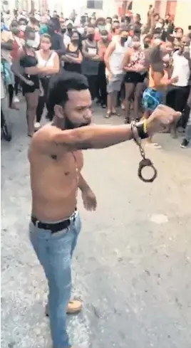  ?? Facebook ?? Rapper Maykel ‘Osorbo’ Castillo shows a handcuff around one wrist after authoritie­s tried to arrest him on April 4, 2020, in Havana.