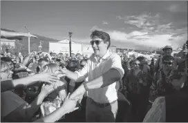  ?? CP PHOTO ?? Prime Minister Justin Trudeau greets people at a Canada Day barbecue in Dawson City, Yukon, on Sunday.