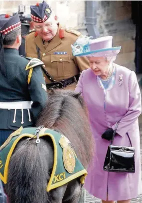  ??  ?? Queen meets Cruachan III, mascot of Argylls, in July, 2007
