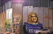  ?? Ahmad Gharabli AFP/Getty Images ?? A MURAL in the occupied West Bank honors slain reporter Shireen abu Akleh, who was killed in May.