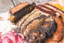  ??  ?? Ribs, brisket and sausage are the draw at Horn Barbecue. To switch the popular popup to a sitdown restaurant has cost around $ 500,000, its owner said.