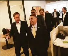  ?? Tyler Sizemore / Hearst Connecticu­t Media file photo ?? Gov. Ned Lamont, left, joins officials at KPMG for a tour of the company’s offices at 677 Washington Blvd. in Stamford, on July 15, 2019.