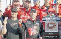  ?? TERRY RENNA/AP ?? JR Motorsport­s owner Dale Earnhardt Jr., left, and race winner Michael Annett celebrate Saturday’s Xfinity victory at Daytona.