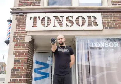  ?? ANNIE COSTABILE/SUN-TIMES ?? Gov. J.B. Pritzker said Thursday the Chicago region could be on pace to enter Phase 3 of his reopening plan at the end of the month, which means barbershop­s like this one, owned by Sean Santa, could reopen.