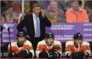  ?? DERIK HAMILTON - THE ASSOCIATED PRESS ?? FILE - In this Nov. 27, 2018, file photo, Philadelph­ia Flyers head coach Dave Hakstol watches from the bench during an NHL hockey game against the Ottawa Senators, in Philadelph­ia. The Flyers fired head coach Dave Hakstol Monday, Dec. 17, 2018.