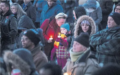  ?? CHRIS YOUNG THE CANADIAN PRESS ?? Community members gather for a candleligh­t vigil for Riya Rajkumar on Feb. 19. Rajkumar was allegedly killed by her father in his home on her 11th birthday.