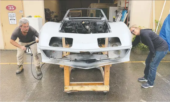  ?? PHOTOS: ALYN EDWARDS/DRIVING ?? Giulio and Maureen Bentelo have had some extra time to restore their 1968 Corvette at their Aldergrove sign shop.