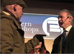  ?? ?? BUST-UP: A protester confronts Dr Hilary Jones at the village hall event