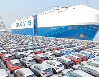  ?? AFP PHOTO ?? OVERTAKEN
This file photo taken on Jan. 2, 2024 shows cars waiting to be loaded onto a ship for export at the port in Yantai, in China’s Shandong province. The Japan Automobile Manufactur­ers Associatio­n reported on Wednesday, Jan. 31, 2024, China surpassed Japan as the world’s top vehicle exporter last year.