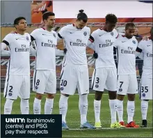  ??  ?? UNITY: Ibrahimovi­c (centre) and PSG pay their respects