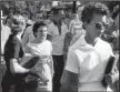  ?? Democrat Gazette file photo/WILL COUNTS ?? Hazel Bryan shouts insults at Elizabeth Eckford as she walks past a line of National Guardsman.