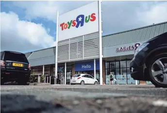  ?? LEON NEAL, GETTY IMAGES ?? Toys R Us curbside pickup could be great for busy parents during the holiday rush but will cut down on the impulse buys people make when they’re inside the store.