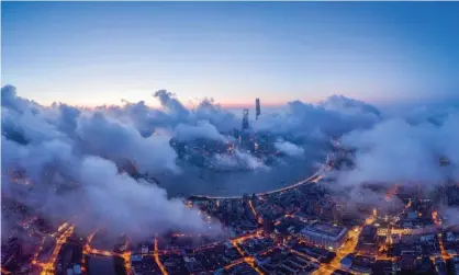  ?? Photograph: VCG/Getty Images ?? Shanghai at sunrise: China has massively ramped up its efforts to control the weather.