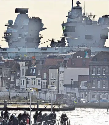  ??  ?? The Royal Navy’s HMS Queen Elizabeth departing from her home base of Portsmouth yesterday morning