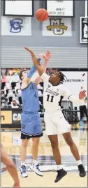  ?? Stew Milne / Associated Press ?? Providence’s A.J. Reeves, right, blocks a shot by Villanova’s Chris Arcidiacon­o on Saturday in Providence, R.I.