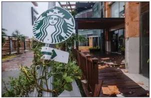  ?? (AP/Victor Ruiz Garcia) ?? A Starbucks coffee shop sign was knocked over by winds from Hurricane Delta in Cancun, Mexico, in this file photo. The global coffee shop chain said Thursday that it plans to increase racial diversity in its workforce.