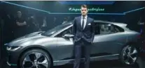  ?? GETTY IMAGES VIA JAGUAR LAND ROVER ?? Washington Nationals baseball player Bryce Harper with the Jaguar I-PACE Concept, an all-electric sport utility vehicle, at the Los Angeles Auto Show.