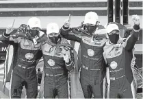  ?? John Raoux, The Associated Press ?? The Konica Minolta racing team, from left, Ricky Taylor, Filipe Albuquerqu­e, Alexander Rossi and Helio Castroneve­s celebrates in Victory Lane.