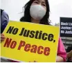  ?? EPA-EFE ?? SOUTH Korean activists hold placards during a rally near the US embassy in Seoul yesterday. |