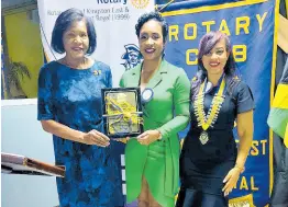  ?? ?? Dr; Marlene Street-Forrest (centre), managing director of the Jamaica Stock Exchange accepts the citation for the Rotary Club of Kingston East & Port Royal’s Vocational Service Award in the organisati­on category at a recent ceremony hosted by the club. Looking on from left are: Richard Hutchinson, Club vice president; Marie Powell, Rotary Past Assistant Governor; Club president Melissa Anderson and Michael Johnson, Club past president of the Club.