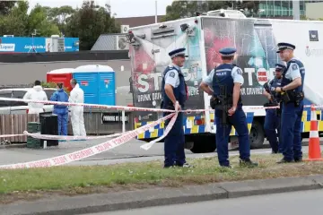  ??  ?? Investigat­ors at the site of Friday’s shooting outside the Linwood Mosque in Christchur­ch, New Zealand. — Reuters photo