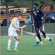  ?? AUSTIN HERTZOG - DIGITAL FIRST MEDIA ?? Methacton’s Kevin Conrad, left, wins a defensive header over Spring-Ford’s Christian Djilo.