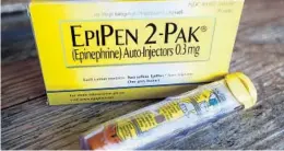  ?? MARK ZALESKI/AP ?? An EpiPen epinephrin­e auto-injector.