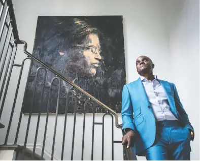  ?? PETER J. THOMPSON / NATIONAL POST ?? Founder and CEO of Kingsdale Advisors Wes Hall, at his Toronto home standing by a wax painting of Rosa Parks, has
started BlackNorth Initiative to encourage corporate Canada to support diversity.