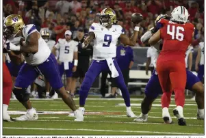  ?? (AP/Rick Scuteri) ?? Washington quarterbac­k Michael Penix Jr. (9) looks to pass against Arizona on Saturday in Tucson, Ariz. Penix went 30 for 40 with 363 yards in Washington‘s 31-24 victory.