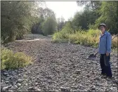  ?? CAROL VALENTINE ?? Jack Dwyer stands on the dry creek bed of Deer Creek in Selma, Ore., on Thursday. In 1972,