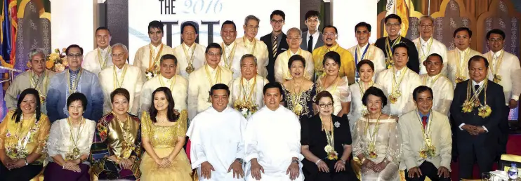  ?? Photo by Joven Cagande ?? The 2016 Outstandin­g Thomasian Alumni (TOTAL) Awardees with UST Rector Rev. Fr. Hermino V. Dagohoy, O.P. (first row, fifth from left), UST Vice Chancellor Rev. Fr. Napoleon Sipalay, Jr., O.P. (first row, sixth from left) and UST OAR director Asst....